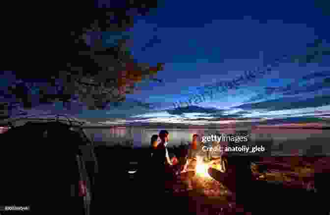 A Group Of People Gathered Around A Campfire On The Shore Of Mackinac Island Midsummer Nights (Secrets Of Mackinac Island 4)