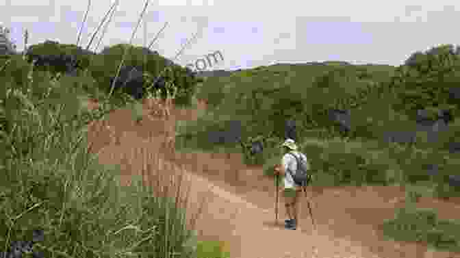 A Hiker On The North Coast Path, Menorca, With The Turquoise Mediterranean Sea In The Background Walk Menorca Casey Stone