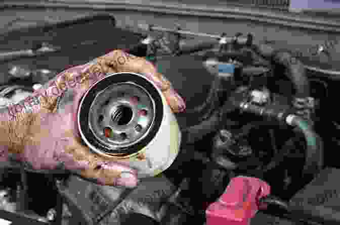 Image Of Person Changing Oil And Filter Top Ten Things To Know About Your 5 9 Cummins Before You Drive Another Mile: Increase The Efficiency And Longevity Of Your 5 9 Cummins Diesel